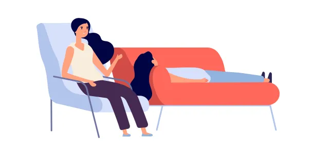 A therapist talking to a client on a couch